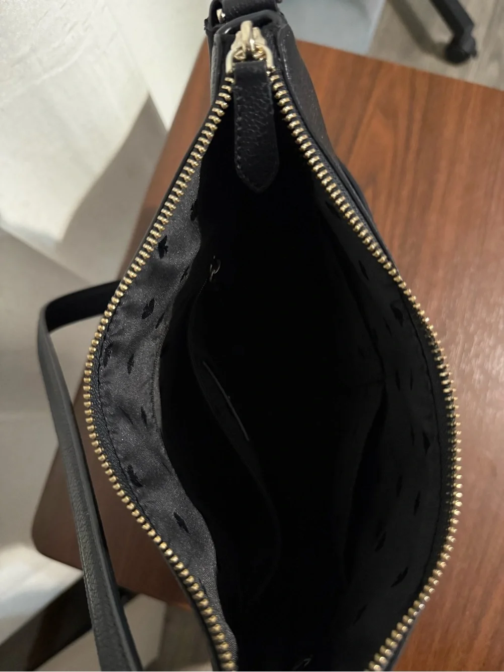 kate spade black pebbled leather shoulder bag with gold logo